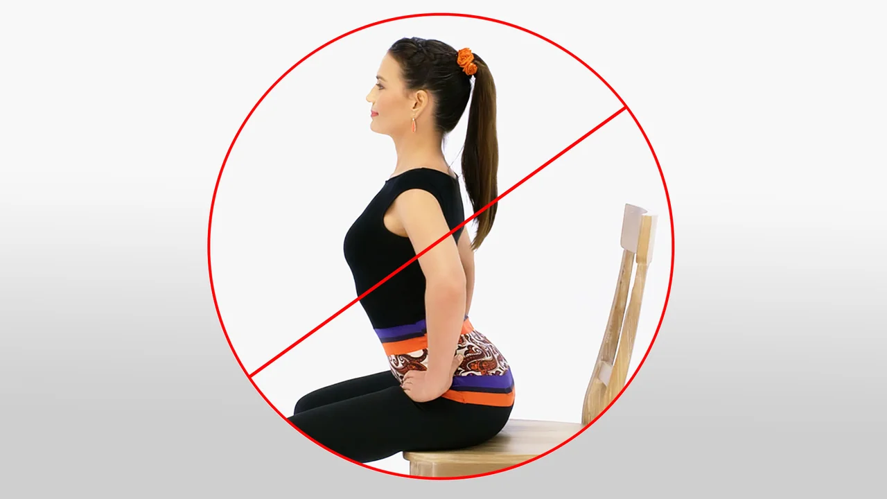 Prohibition symbol over a woman doing a backbend while seated on a chair, indicating this pose should be avoided